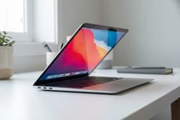 Angled view of MacBook Air M1 showing how slim it is.